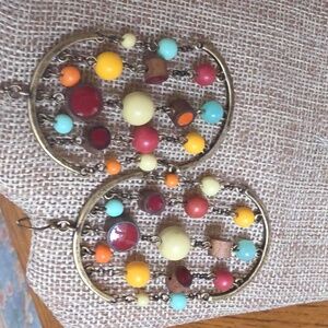 Bohemian-style beaded hoop earrings with multi-colored acrylic and wood